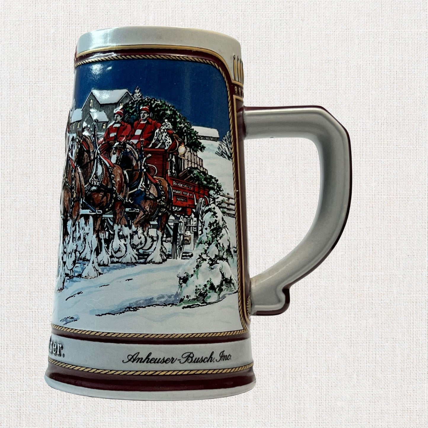 Budweiser 1989 ceramic beer stein with holiday Clydesdale scene, on neutral background, vintage home decor or collectible.