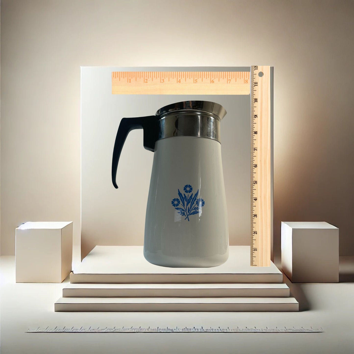 Corningware blue cornflower coffee pot on neutral background, vintage home decor or collectible.
