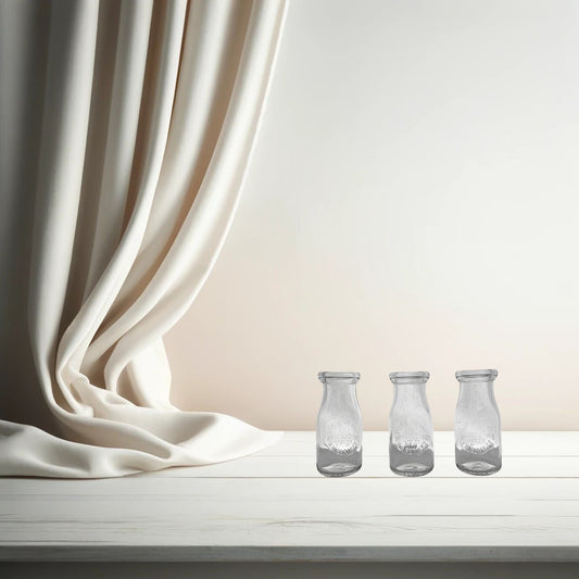 Branglebrink embossed cream bottles on neutral background, vintage home decor or collectible.