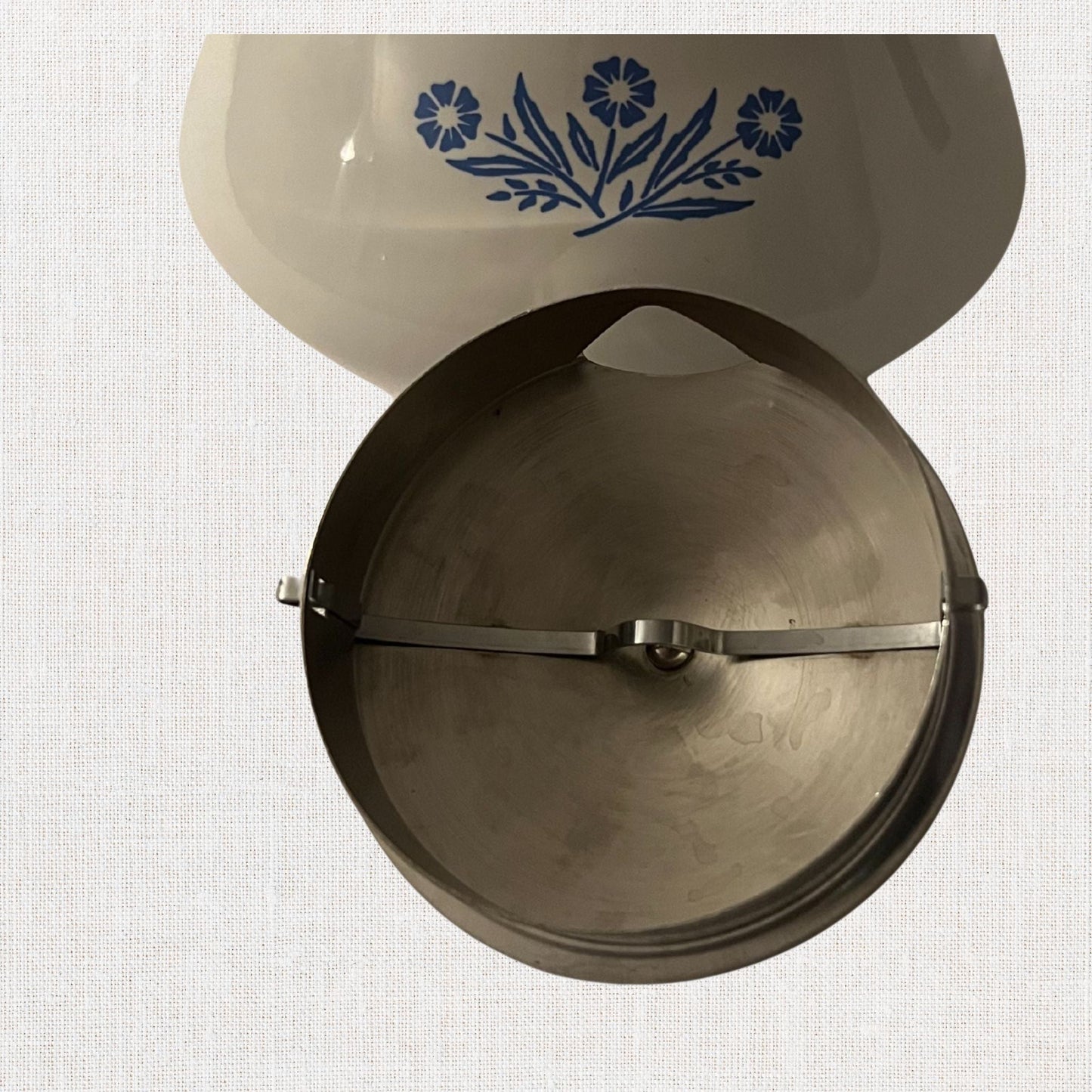 Corningware blue cornflower tea pot on neutral background, vintage home decor or collectible.