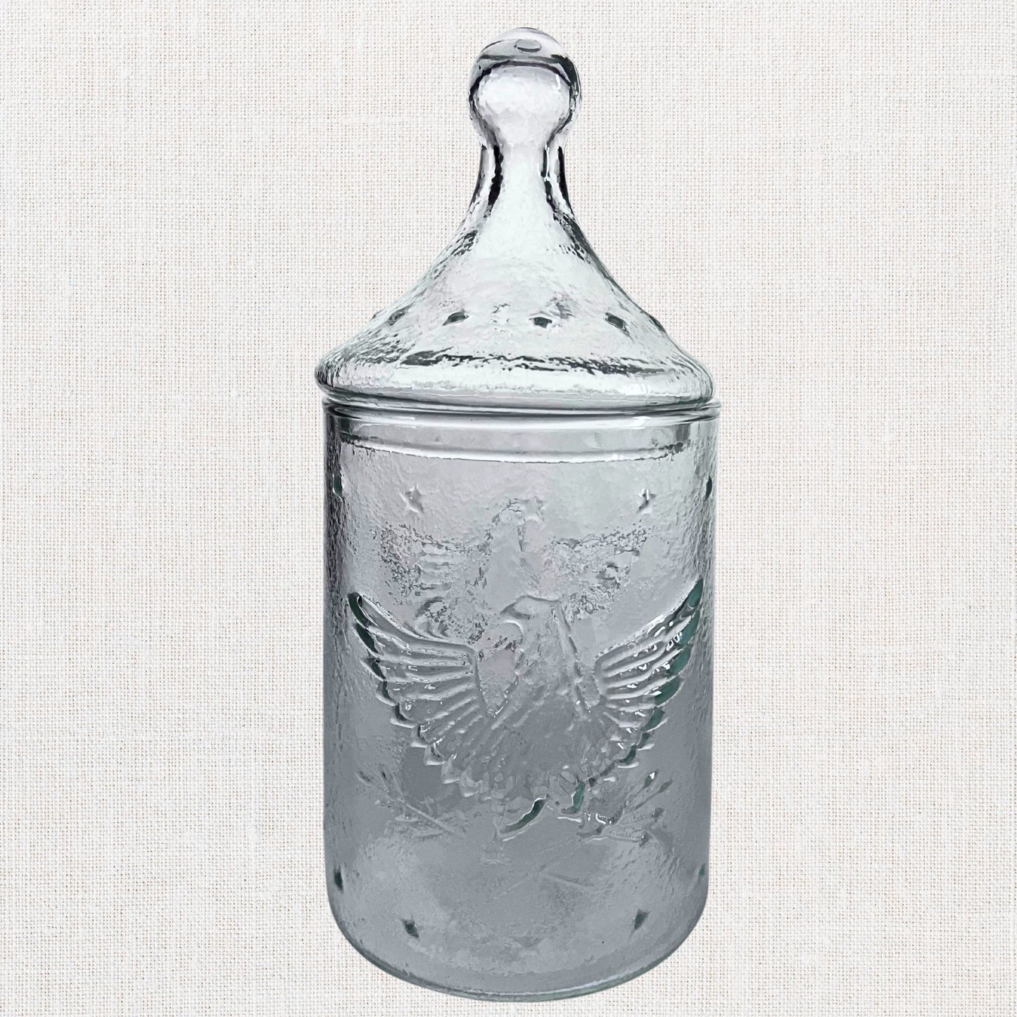 Apocathary jar with eagle and stars on neutral background, vintage home decor or collectible.