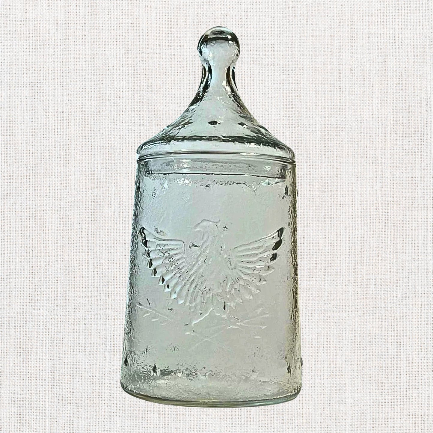 Apocathary jar with eagle and stars on neutral background, vintage home decor or collectible.