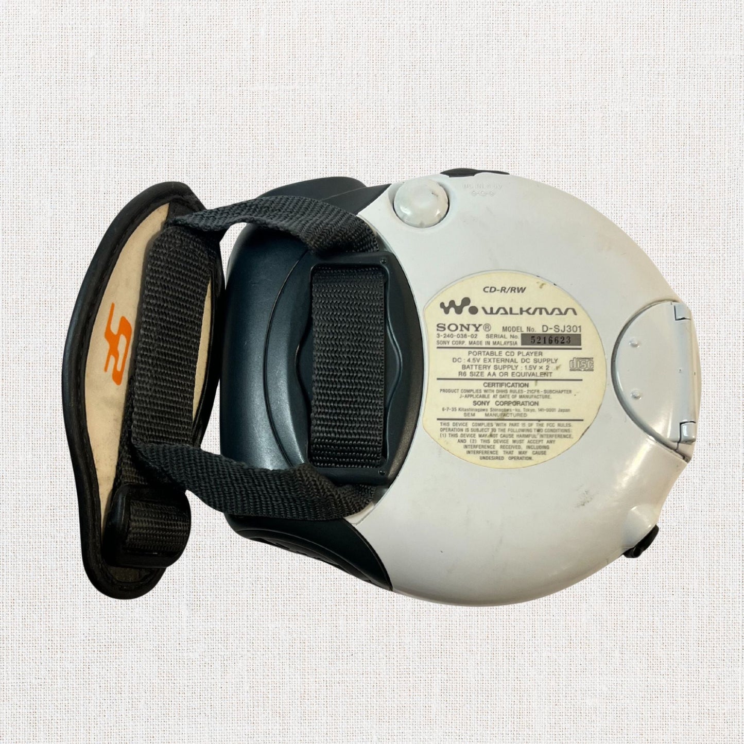 Sony discman model d-sj301 working on neutral background, vintage home decor or collectible.
