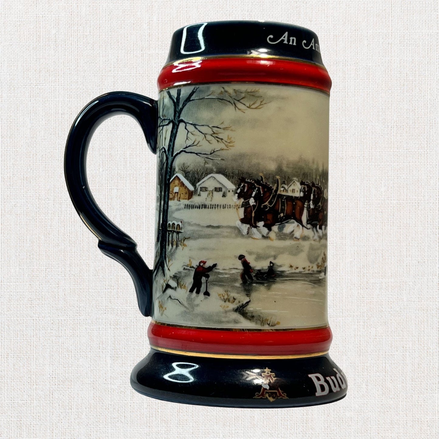 Budweiser 1990 collectible beer stein – winter village design, on neutral background, vintage home decor or collectible.