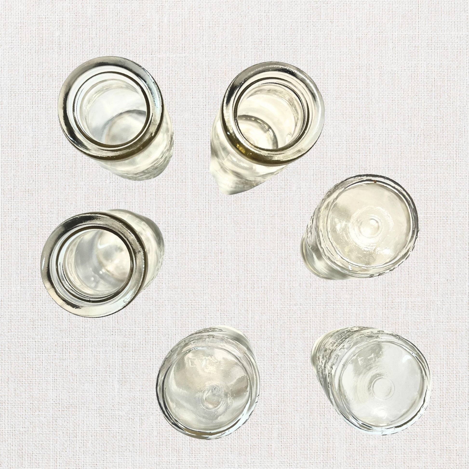 Branglebrink embossed cream bottles on neutral background, vintage home decor or collectible.