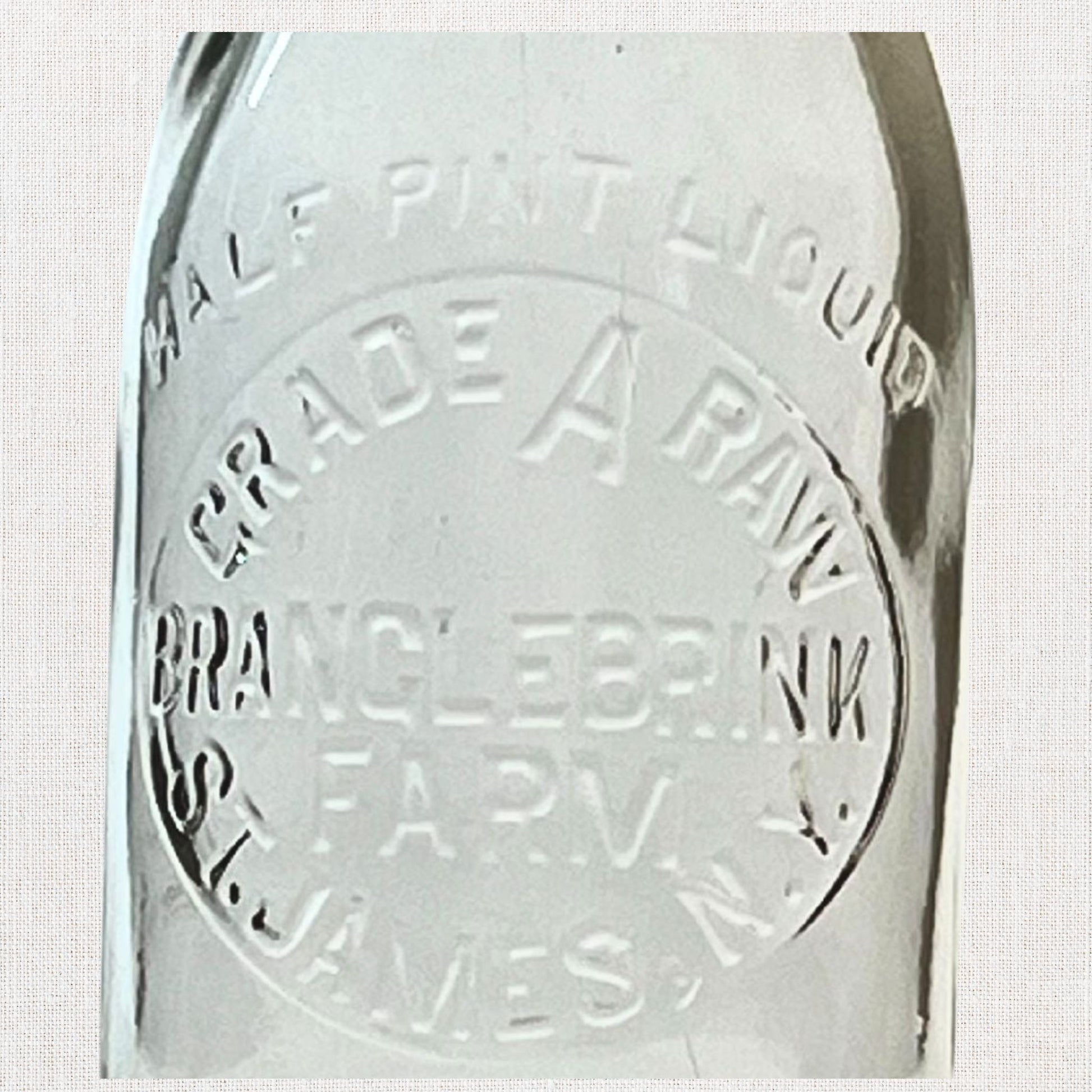 Branglebrink embossed cream bottles on neutral background, vintage home decor or collectible.