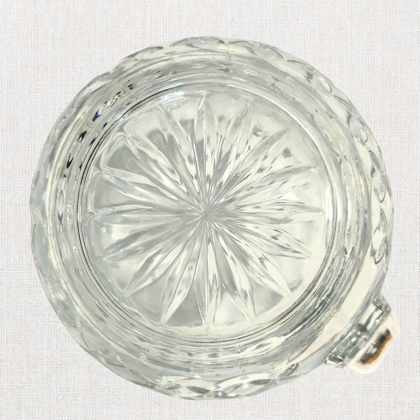 Diamond cut crystal stout pitcher on neutral background, vintage home decor or collectible.