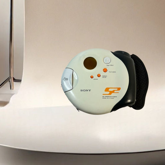 Sony discman model d-sj301 working on neutral background, vintage home decor or collectible.