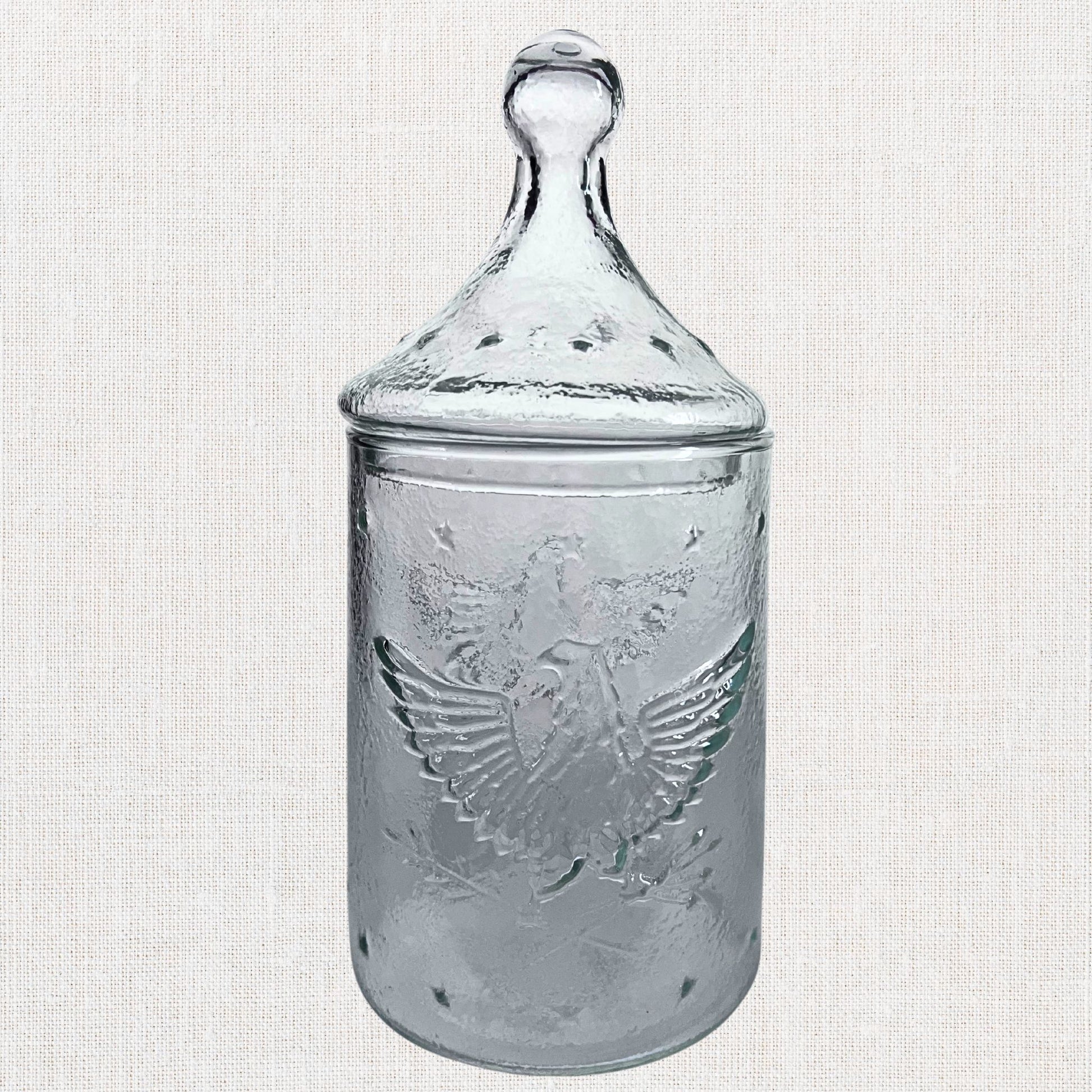 Apocathary jar with eagle and stars on neutral background, vintage home decor or collectible.