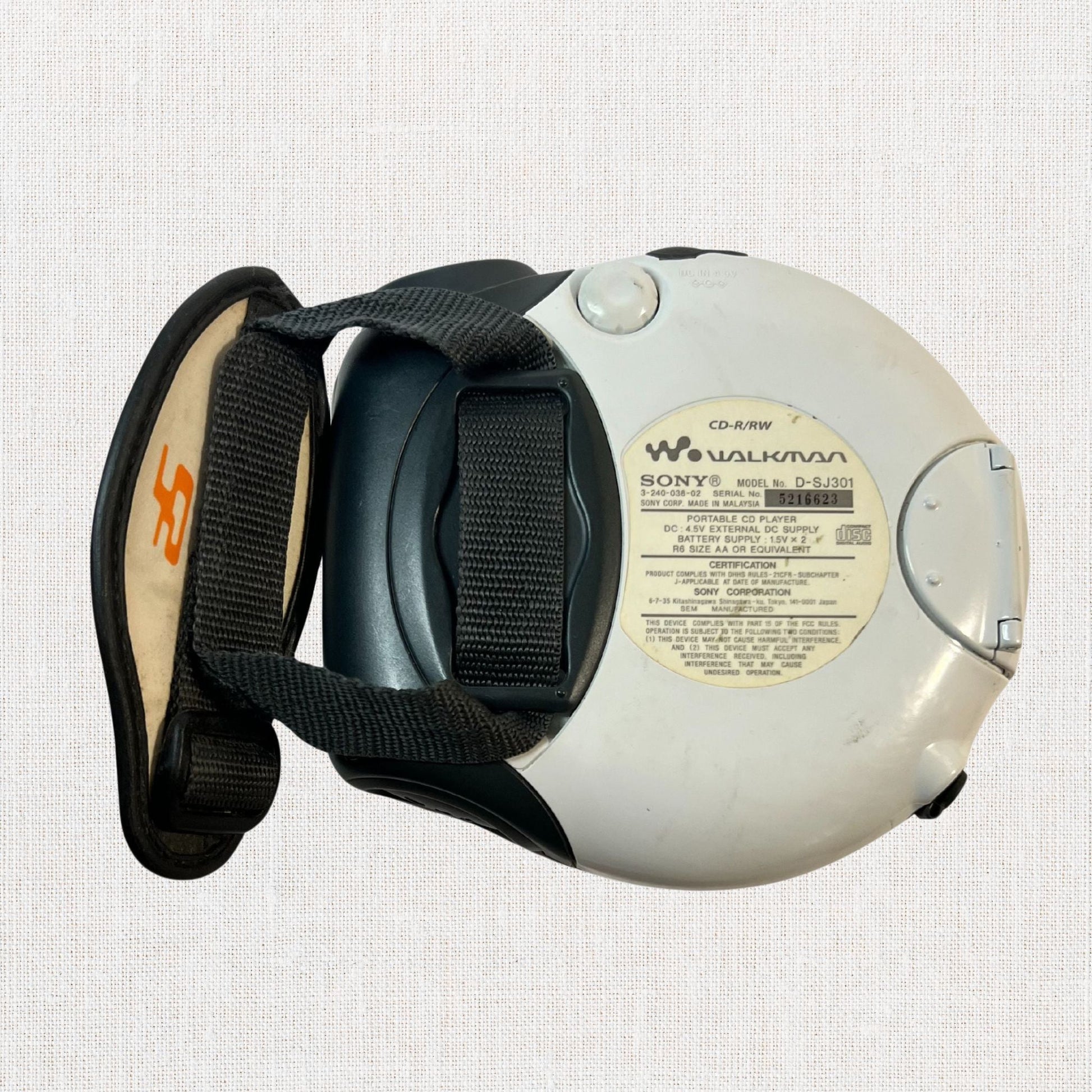 Sony discman model d-sj301 working on neutral background, vintage home decor or collectible.