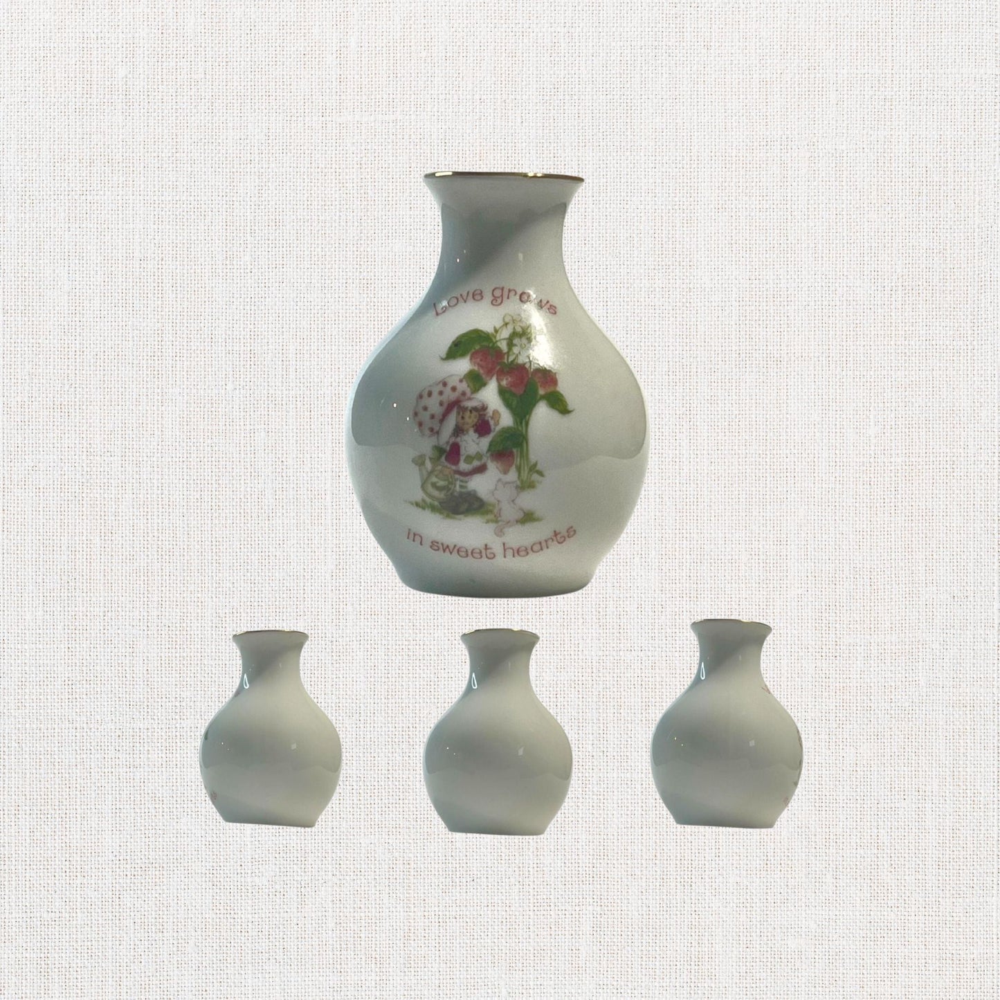 Strawberry Shortcake ceramic bud vase with vintage cartoon character , on neutral background, vintage home decor or collectible.
