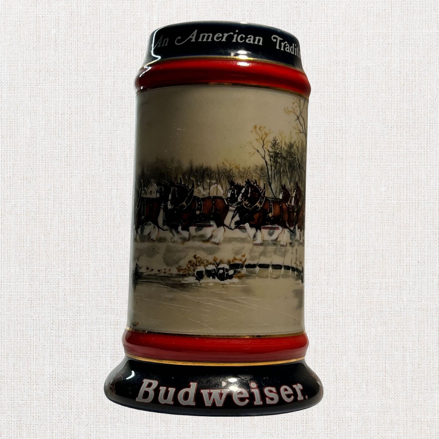 Budweiser 1990 collectible beer stein – winter village design, on neutral background, vintage home decor or collectible.