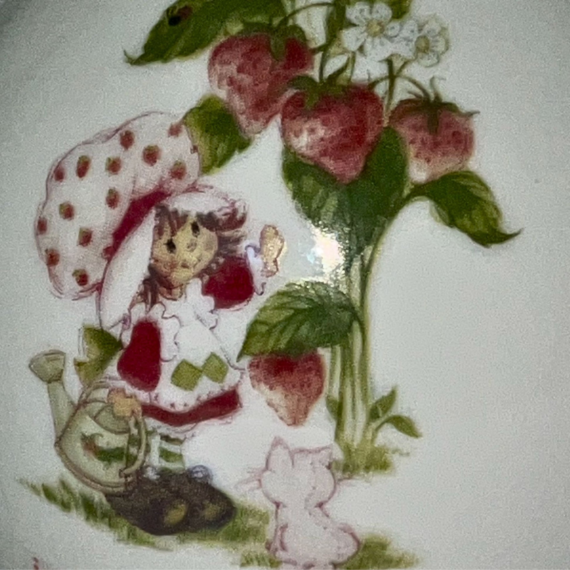 Strawberry Shortcake ceramic bud vase with vintage cartoon character , on neutral background, vintage home decor or collectible.